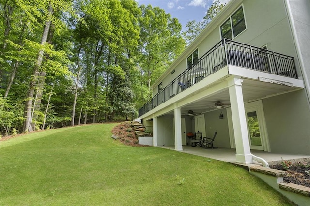660 Willow Knoll Dr SE, Marietta, GA 30067 - view of grassy yard with a balcony, ceiling fan, and a patio