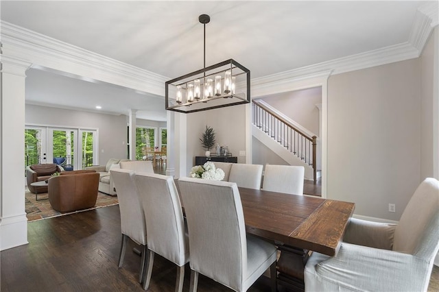 660 Willow Knoll Dr SE, Marietta, GA 30067 - dining space featuring decorative columns, dark wood finished floors, ornamental molding, a chandelier, and stairway