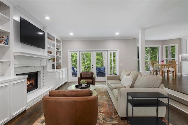 660 Willow Knoll Dr SE, Marietta, GA 30067 - living room with decorative columns, ornamental molding, a fireplace, dark wood-type flooring, and recessed lighting