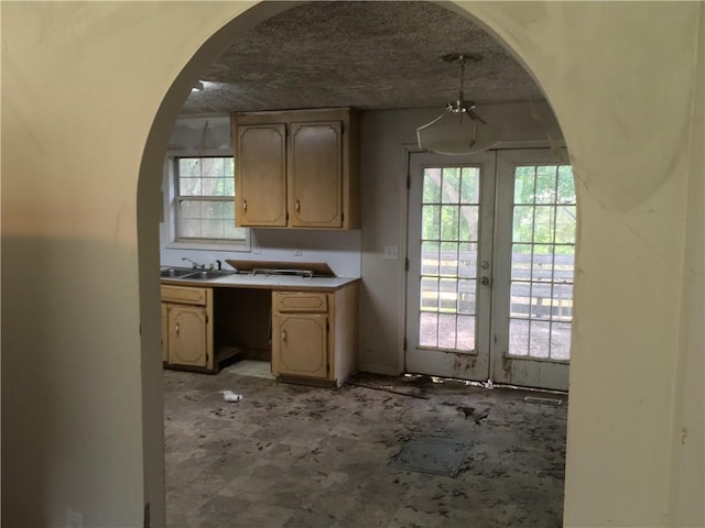 290 Covered Bridge Rd SW, Cartersville, GA 30120 - kitchen featuring arched walkways, french doors, healthy amount of natural light, and light countertops