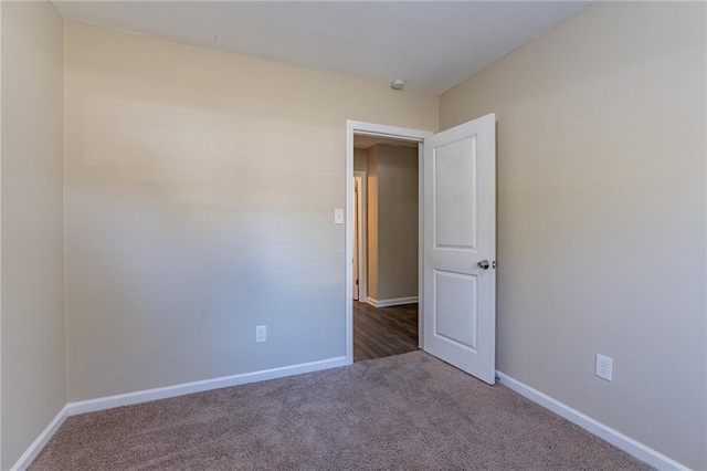 empty room with carpet flooring