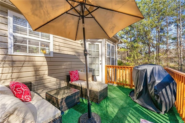 deck with area for grilling and a yard