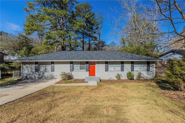 ranch-style house featuring a front yard, a shingled roof, concrete driveway, crawl space, and brick siding