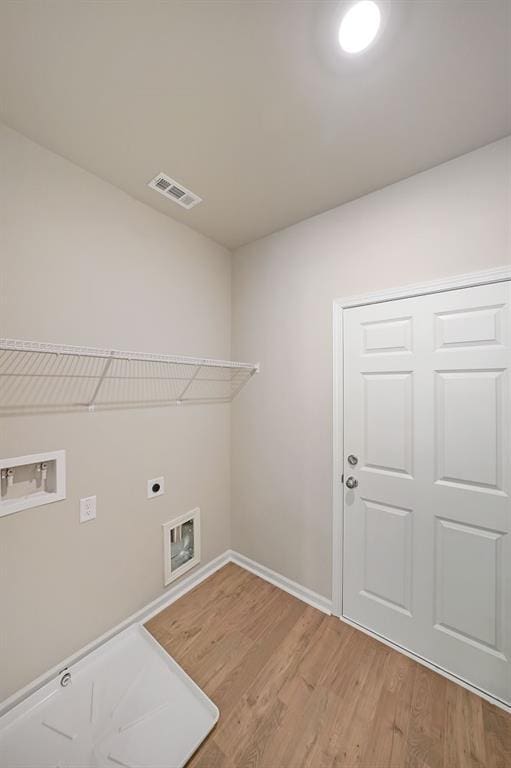 175 W Woods Dr, Dahlonega, GA 30533 - washroom featuring hookup for an electric dryer, washer hookup, light wood-type flooring, and baseboards