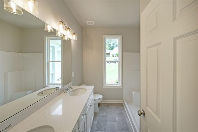 175 W Woods Dr, Dahlonega, GA 30533 - bathroom with toilet, double vanity, baseboards, a shower, and a tub