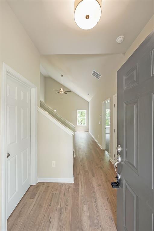 175 W Woods Dr, Dahlonega, GA 30533 - entrance foyer featuring light wood-type flooring, ceiling fan, vaulted ceiling, and baseboards
