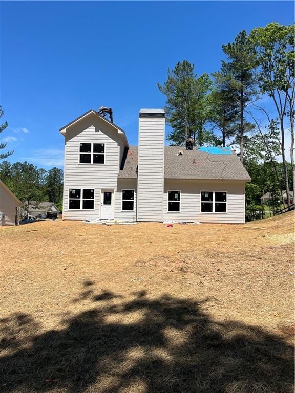 175 W Woods Dr, Dahlonega, GA 30533 - back of property featuring a chimney and a shingled roof
