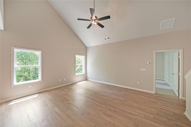 175 W Woods Dr, Dahlonega, GA 30533 - spare room featuring high vaulted ceiling, ceiling fan, light wood-style flooring, and baseboards