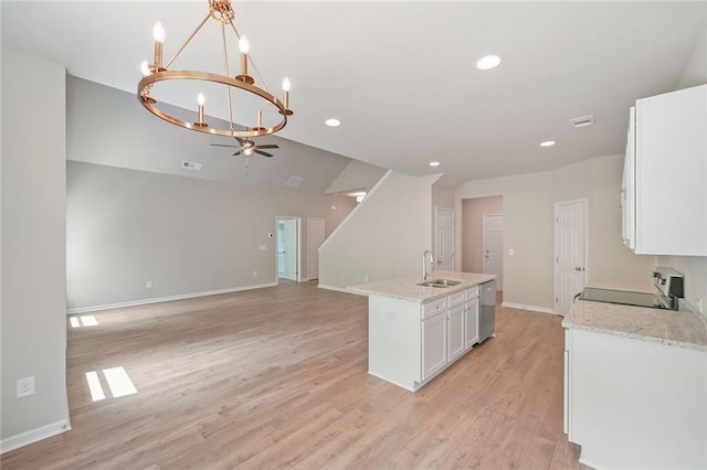 175 W Woods Dr, Dahlonega, GA 30533 - kitchen with a sink, electric range, a chandelier, white cabinets, and light wood-type flooring