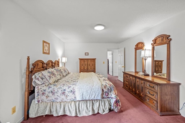 carpeted bedroom with baseboards