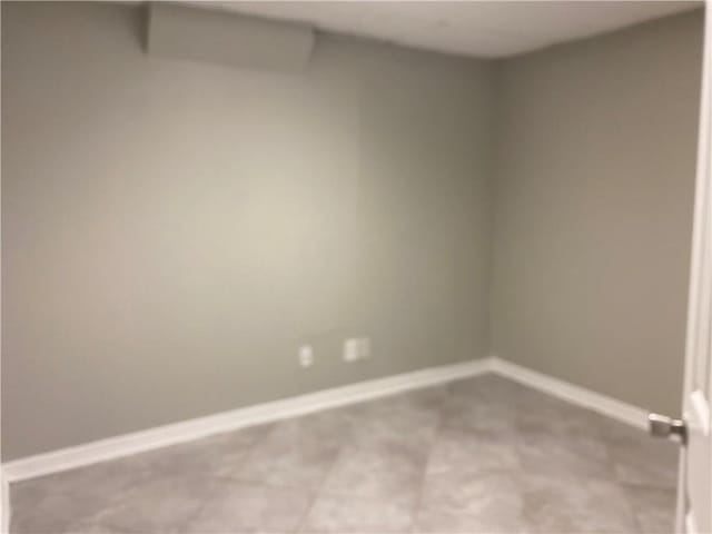 spare room featuring light colored carpet