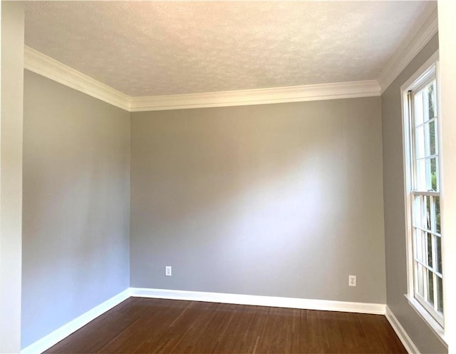 spare room with crown molding, a textured ceiling, and dark hardwood / wood-style flooring