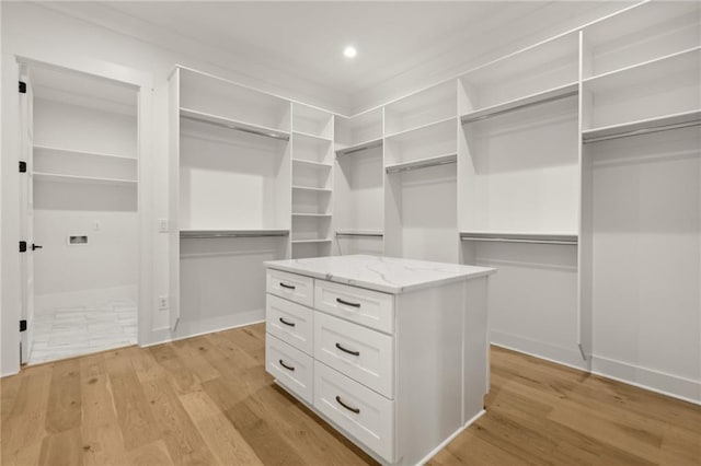 spacious closet featuring light wood-type flooring
