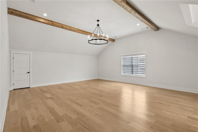 additional living space featuring lofted ceiling with beams, a notable chandelier, baseboards, and light wood-type flooring