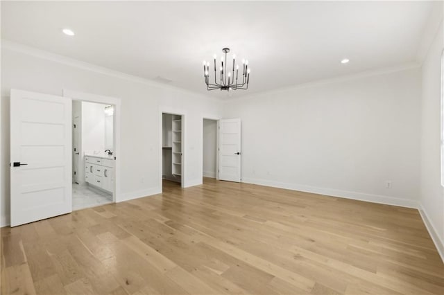 unfurnished bedroom featuring light wood-style floors, baseboards, and ornamental molding