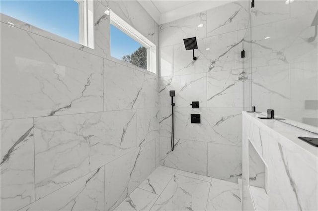 full bathroom featuring a marble finish shower and marble finish floor