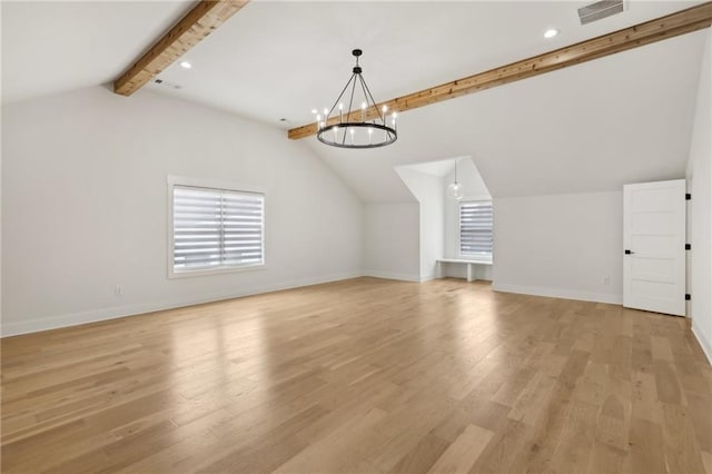 additional living space featuring a chandelier, visible vents, light wood finished floors, and lofted ceiling with beams