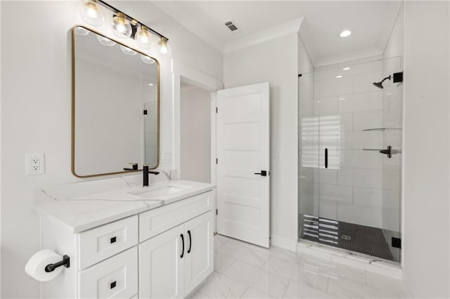 bathroom featuring visible vents, vanity, a stall shower, and crown molding