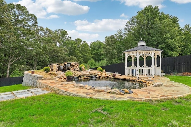 view of yard with a gazebo and fence