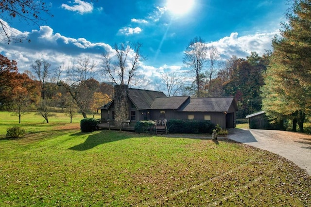16810 Morganton Hwy, Morganton, GA 30560 - view of front facade featuring driveway, a chimney, a deck, and a front yard