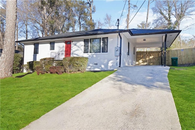 single story home featuring concrete driveway, fence, and a front lawn