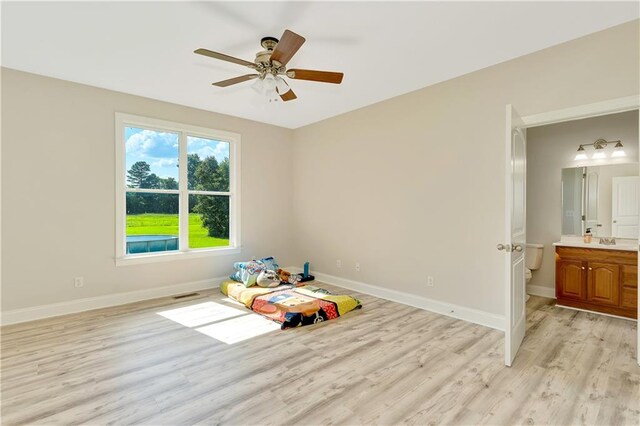 game room featuring light hardwood / wood-style floors and ceiling fan