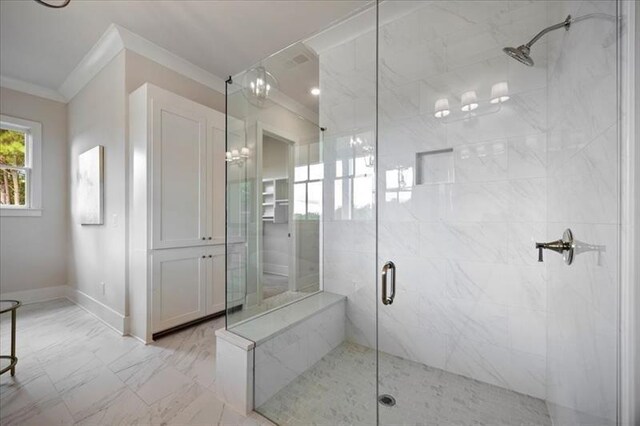 full bath with ornamental molding, a stall shower, and marble look tile flooring