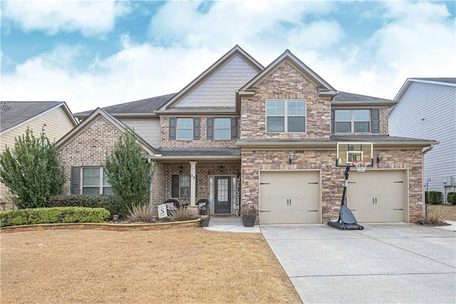 craftsman house with a garage and a front yard