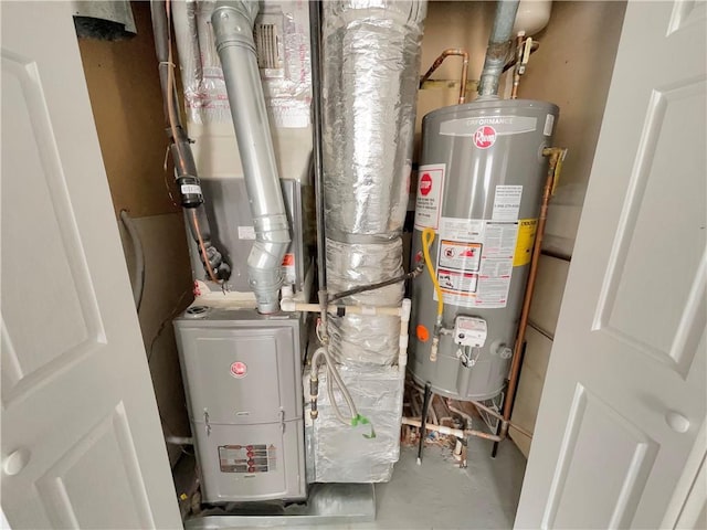 utility room with gas water heater