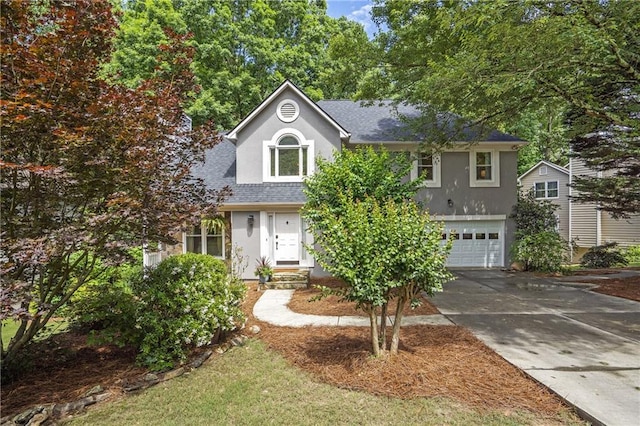 1867 N Creek Cir, Alpharetta, GA 30009 - view of front facade with a shingled roof, driveway, stucco siding, and an attached garage