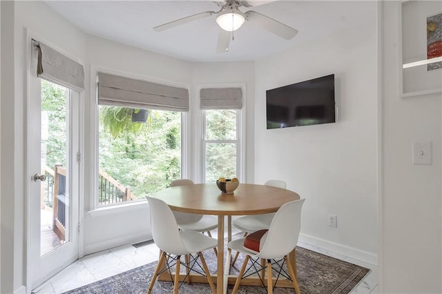1867 N Creek Cir, Alpharetta, GA 30009 - dining area featuring light marble finish floors, ceiling fan, and baseboards