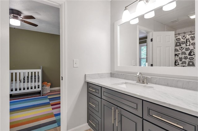 1867 N Creek Cir, Alpharetta, GA 30009 - bathroom featuring vanity, ceiling fan, and baseboards