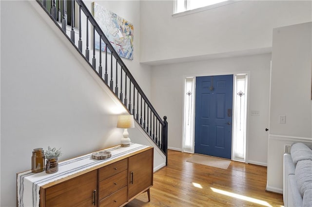 1867 N Creek Cir, Alpharetta, GA 30009 - entryway with stairway, light wood-style floors, baseboards, and a towering ceiling