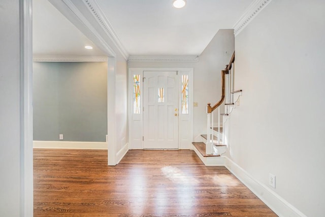 foyer entrance featuring hardwood / wood-style floors and ornamental molding