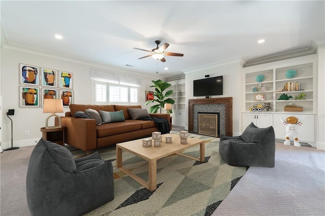 carpeted living room with ornamental molding, a fireplace, and baseboards