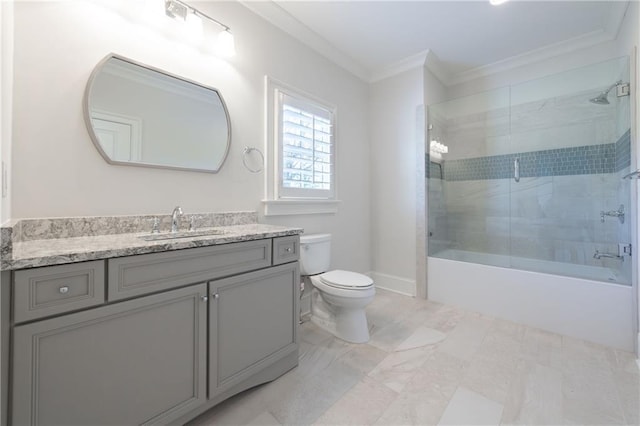 bathroom with toilet, shower / bath combination with glass door, vanity, baseboards, and crown molding