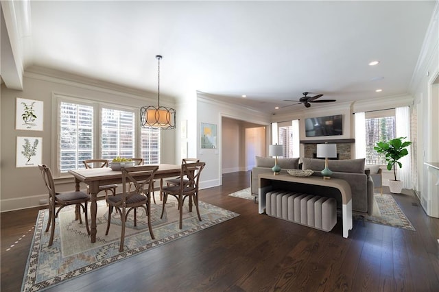 dining area with baseboards, dark wood-style flooring, recessed lighting, and crown molding