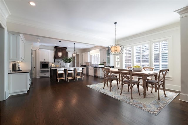 dining area with recessed lighting, dark wood-style flooring, crown molding, and baseboards