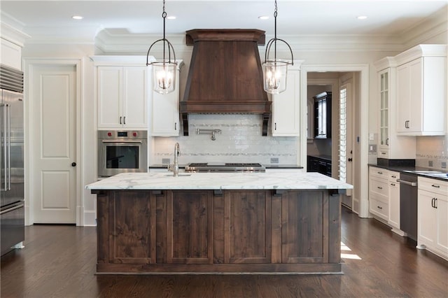 kitchen with stainless steel appliances, dark wood-style flooring, premium range hood, and white cabinetry