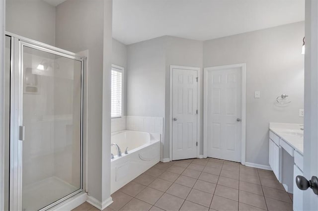 bathroom with tile patterned floors, separate shower and tub, and vanity