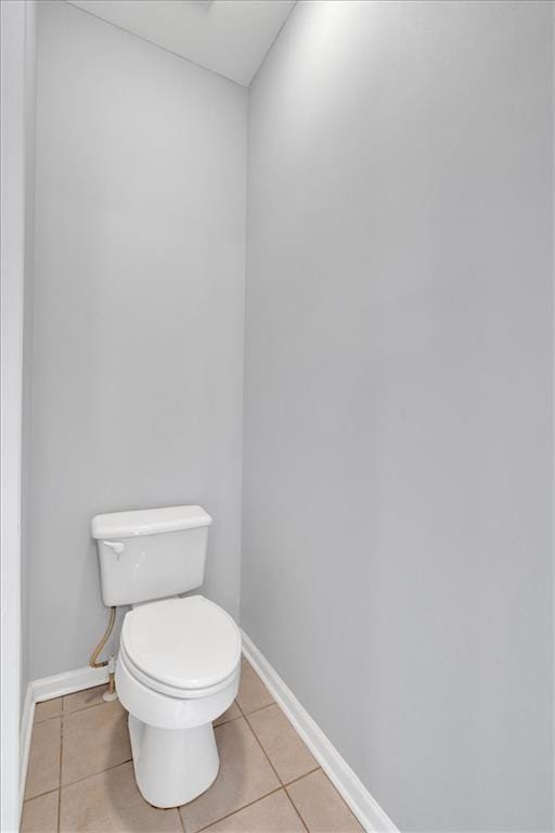 bathroom featuring tile patterned floors and toilet