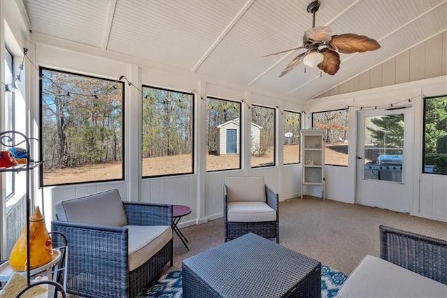 sunroom / solarium featuring ceiling fan and lofted ceiling