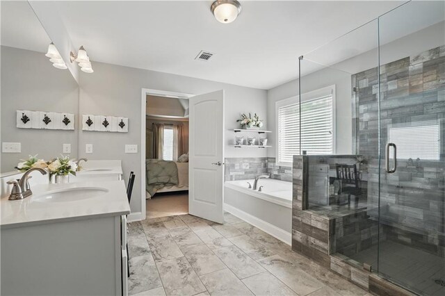 1255 Double Branches Ln, Dallas, GA 30132 - bathroom with healthy amount of natural light, connected bathroom, a garden tub, and a stall shower