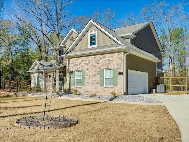 view of front of home featuring concrete driveway, brick siding, a front lawn, and central air condition unit