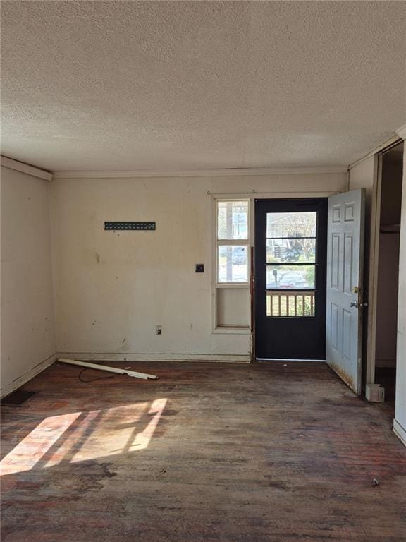 entryway with a textured ceiling and dark wood-type flooring