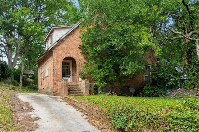 1200 Mansfield Ave NE, Atlanta, GA 30307 - view of front of house featuring brick siding and asphalt driveway