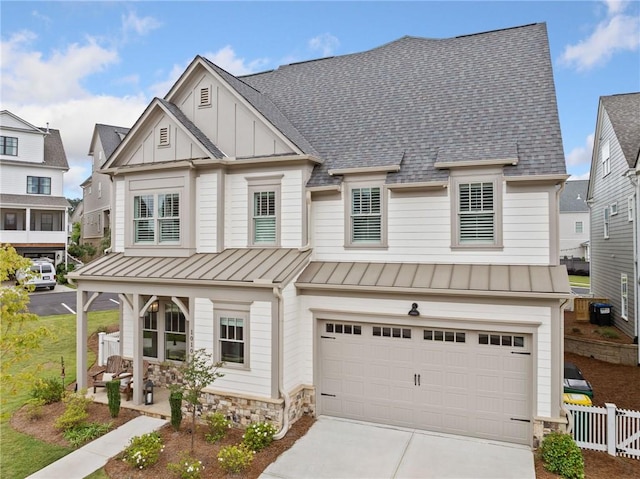 1010 Fendley St, Woodstock, GA 30188 - view of front of house with a porch, a standing seam roof, an attached garage, and a shingled roof