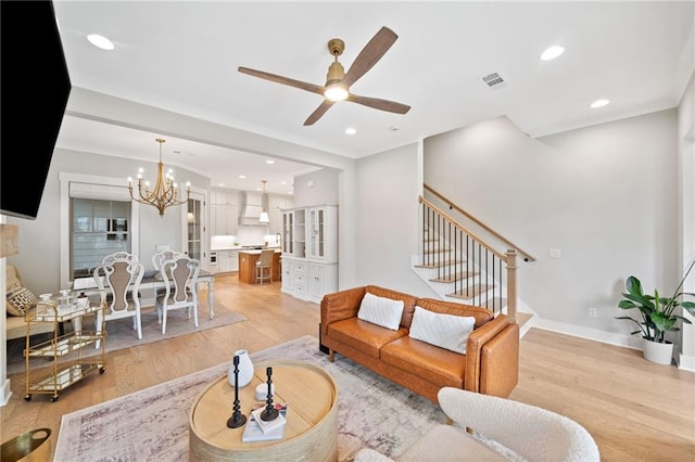 1010 Fendley St, Woodstock, GA 30188 - living area featuring light wood-style floors, a chandelier, stairway, ceiling fan, and recessed lighting