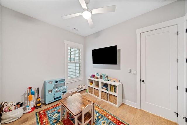 1010 Fendley St, Woodstock, GA 30188 - living area with wood finished floors, ceiling fan, and baseboards