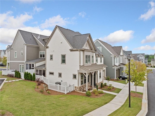 1010 Fendley St, Woodstock, GA 30188 - view of home's exterior with a residential view, a yard, driveway, and roof with shingles